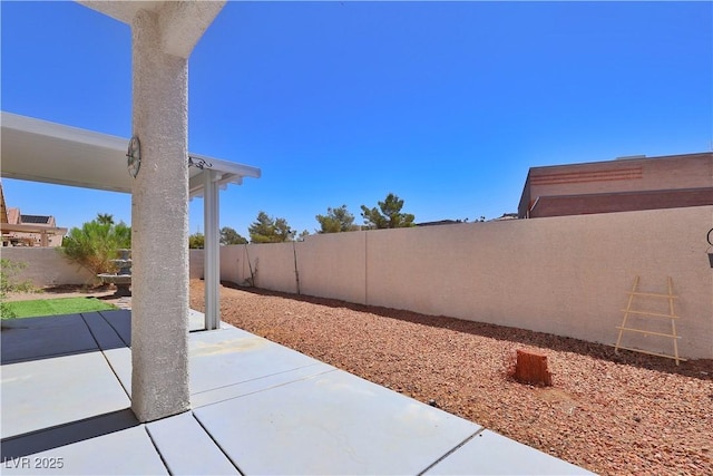 975 Leadville Meadows Dr, Henderson, NV 89052 - fenced backyard with a patio