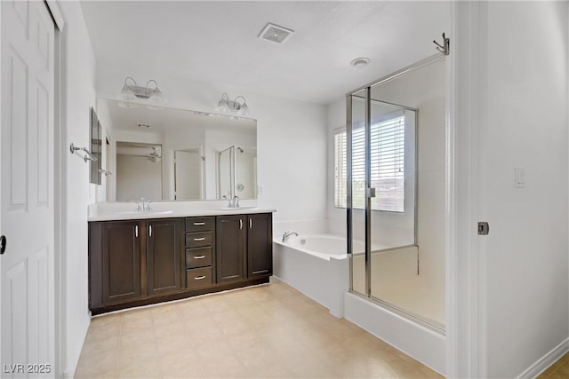 7263 Pepperbox Ave, Las Vegas, NV 89179 - bathroom with double vanity, a bath, a stall shower, and tile patterned floors