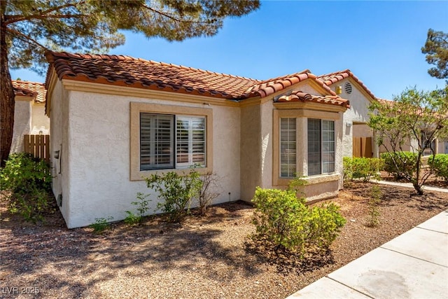 5424 Geneive Ln Unit 105, Las Vegas, NV 89108 - view of side of home with stucco siding and a tile roof