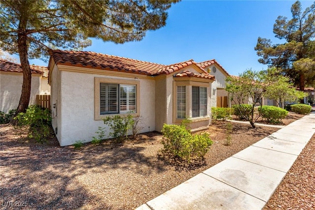 5424 Geneive Ln Unit 105, Las Vegas, NV 89108 - view of front of house featuring stucco siding and a tiled roof