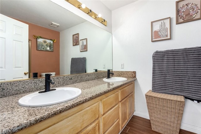 5424 Geneive Ln Unit 105, Las Vegas, NV 89108 - full bathroom with double vanity and wood finished floors