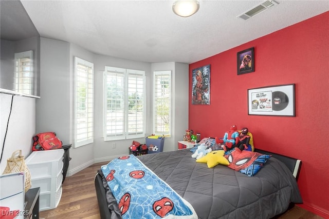5424 Geneive Ln Unit 105, Las Vegas, NV 89108 - bedroom with wood finished floors and baseboards