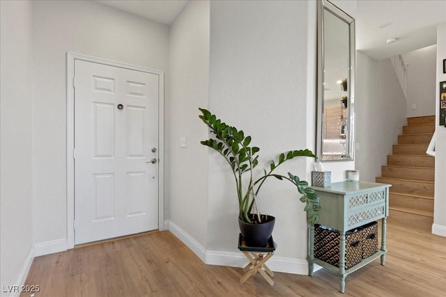 694 Value Ridge Ave, Henderson, NV 89012 - entrance foyer with light wood-type flooring and stairway