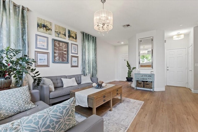 694 Value Ridge Ave, Henderson, NV 89012 - living area featuring a chandelier, wood finished floors, and recessed lighting