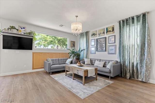 694 Value Ridge Ave, Henderson, NV 89012 - living area with a chandelier and light wood finished floors