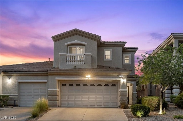 694 Value Ridge Ave, Henderson, NV 89012 - view of front of home featuring concrete driveway, stucco siding, and a garage