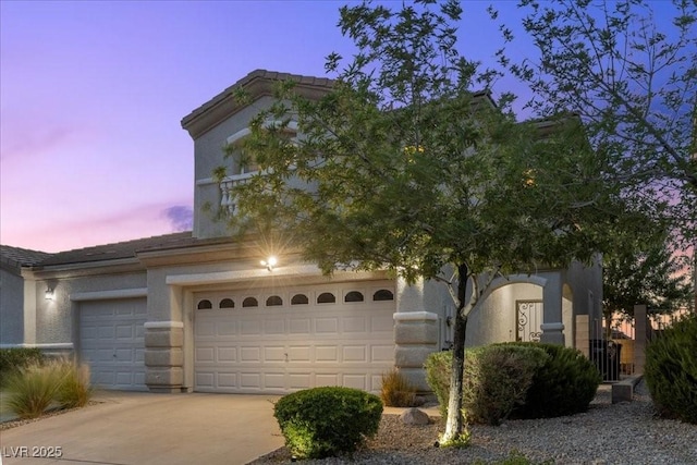 694 Value Ridge Ave, Henderson, NV 89012 - view of front facade featuring concrete driveway and stucco siding