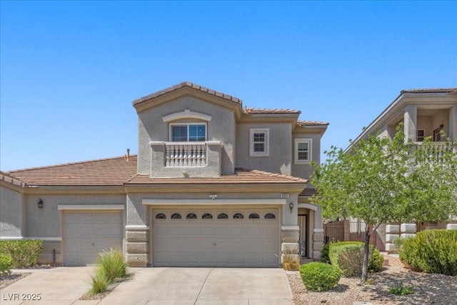 694 Value Ridge Ave, Henderson, NV 89012 - view of front of property featuring concrete driveway, a garage, a tiled roof, and stucco siding