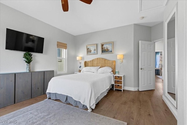 694 Value Ridge Ave, Henderson, NV 89012 - bedroom featuring wood finished floors, a ceiling fan, and attic access