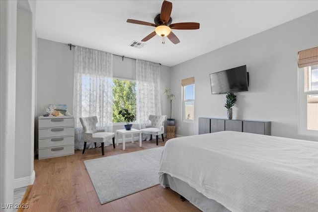 694 Value Ridge Ave, Henderson, NV 89012 - bedroom featuring multiple windows, wood finished floors, and ceiling fan