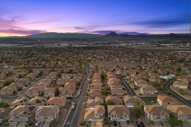 694 Value Ridge Ave, Henderson, NV 89012 - aerial overview of property's location with a mountainous background and nearby suburban area