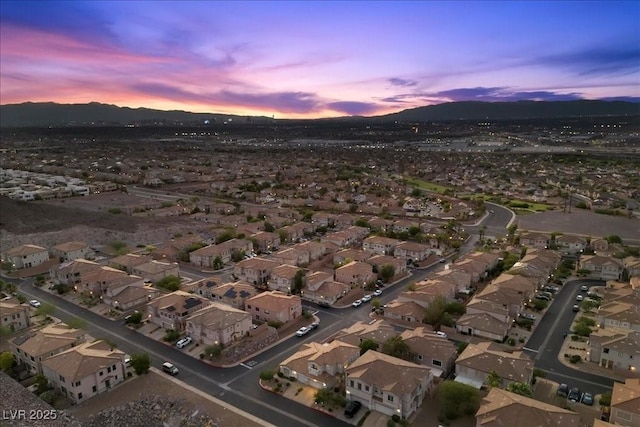 694 Value Ridge Ave, Henderson, NV 89012 - aerial view of property and surrounding area with a mountainous background and nearby suburban area