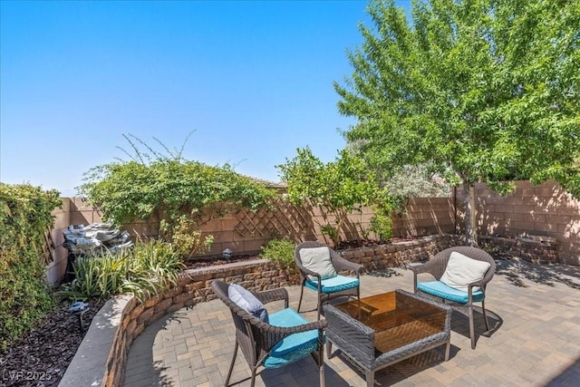 694 Value Ridge Ave, Henderson, NV 89012 - fenced backyard with a patio area