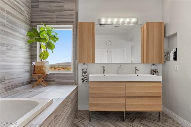 694 Value Ridge Ave, Henderson, NV 89012 - bathroom featuring double vanity and tiled bath