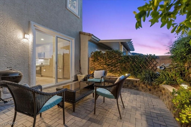 694 Value Ridge Ave, Henderson, NV 89012 - patio terrace at dusk with a patio