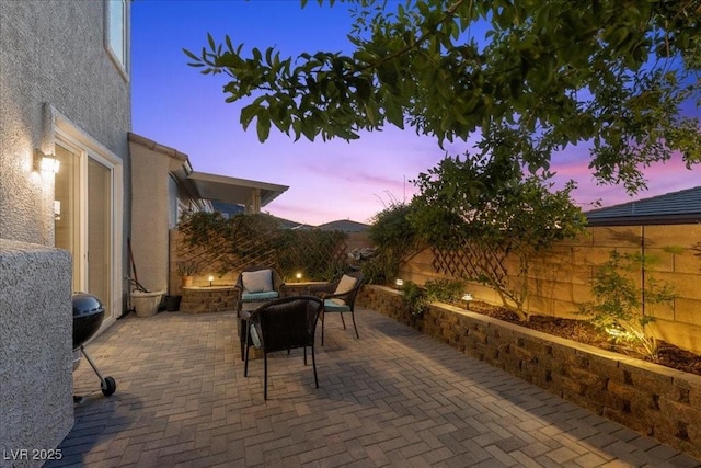 694 Value Ridge Ave, Henderson, NV 89012 - fenced backyard featuring an outdoor fire pit and a patio