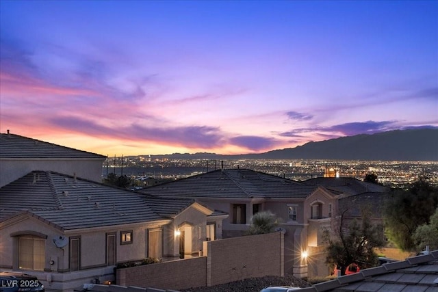 694 Value Ridge Ave, Henderson, NV 89012 - view of front of home with a tile roof, a mountain view, and stucco siding