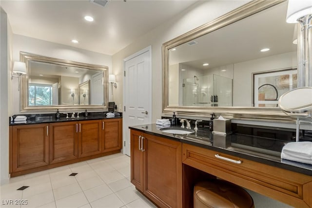 135 E Harmon Ave Unit 2702, Las Vegas, NV 89109 - bathroom featuring a stall shower, vanity, tile patterned flooring, and recessed lighting