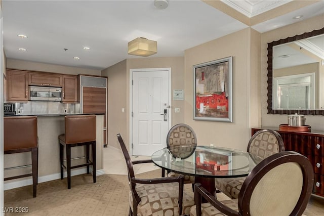 135 E Harmon Ave Unit 2702, Las Vegas, NV 89109 - dining space with recessed lighting and crown molding