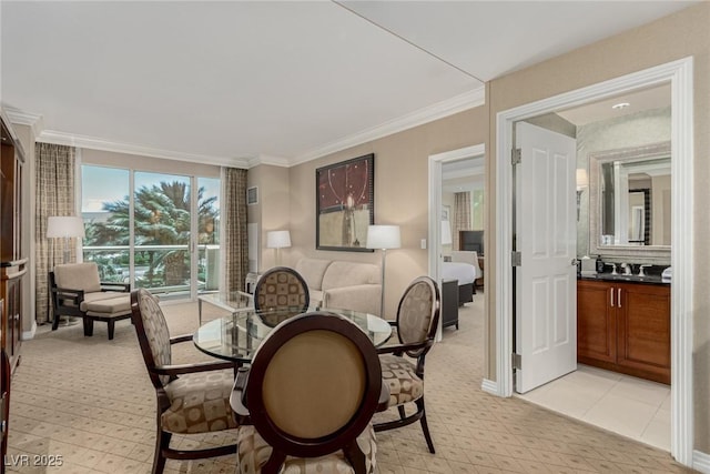135 E Harmon Ave Unit 2702, Las Vegas, NV 89109 - dining room featuring ornamental molding and light colored carpet