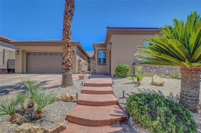 2779 Kindeace Ave, Henderson, NV 89044 - view of front of property featuring stucco siding, an attached garage, driveway, and a gate