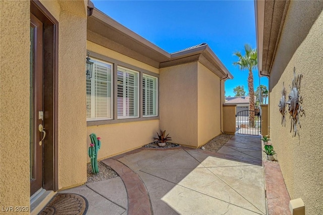 2779 Kindeace Ave, Henderson, NV 89044 - view of home's exterior featuring a gate, stucco siding, and a patio area