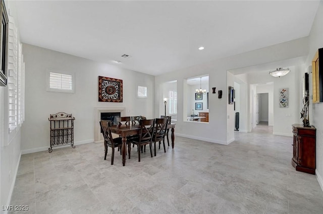 2779 Kindeace Ave, Henderson, NV 89044 - dining room featuring a chandelier, a fireplace, and recessed lighting