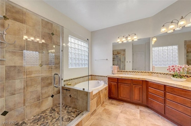 2779 Kindeace Ave, Henderson, NV 89044 - bathroom with a bath, a shower stall, vanity, and tile patterned floors