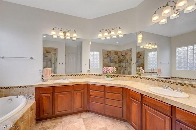 2779 Kindeace Ave, Henderson, NV 89044 - bathroom featuring a shower stall, double vanity, a bath, tile patterned flooring, and tasteful backsplash
