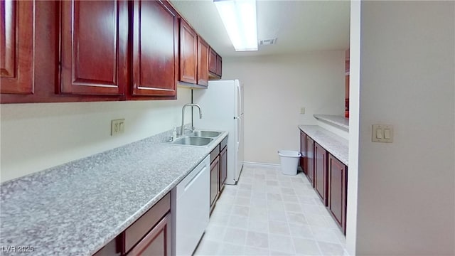 4990 River Glen Dr Unit 171, Las Vegas, NV 89103 - kitchen with dark brown cabinets, dishwasher, and light countertops