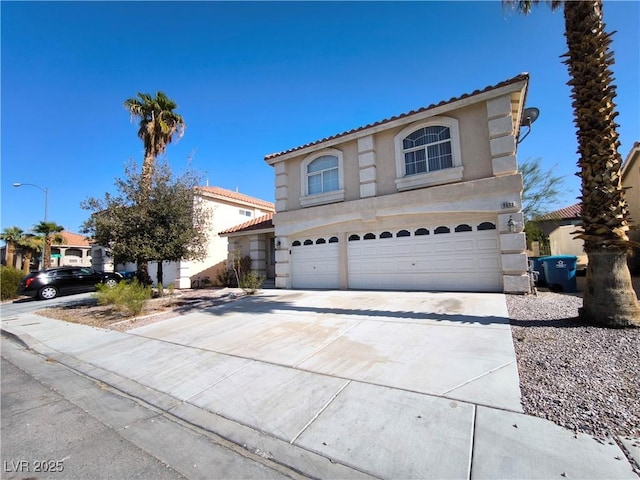 9693 Bighorn Island Ave, Las Vegas, NV 89148 - view of front of property featuring an attached garage, stucco siding, a tile roof, and driveway