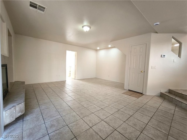 9693 Bighorn Island Ave, Las Vegas, NV 89148 - unfurnished living room featuring light tile patterned floors, a fireplace, and recessed lighting