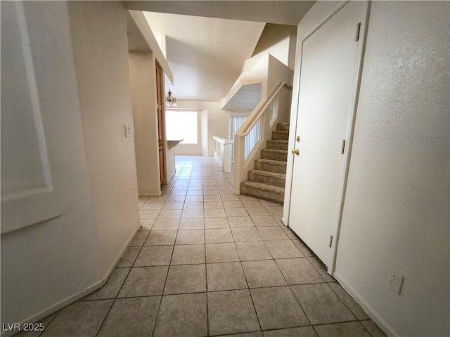 9693 Bighorn Island Ave, Las Vegas, NV 89148 - corridor featuring light tile patterned floors and stairs