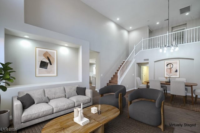 7619 Comanche Canyon Ave, Las Vegas, NV 89113 - living room featuring stairway, a high ceiling, and recessed lighting