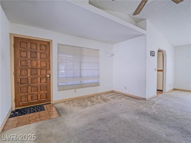 1409 Santa Margarita St Unit G, Las Vegas, NV 89146 - carpeted entryway featuring lofted ceiling and a textured ceiling