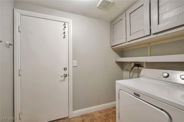 5732 Hornbrook St, North Las Vegas, NV 89031 - laundry area with washer / dryer, cabinet space, and light tile patterned floors
