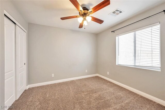 5732 Hornbrook St, North Las Vegas, NV 89031 - unfurnished bedroom featuring carpet flooring, a closet, and a ceiling fan
