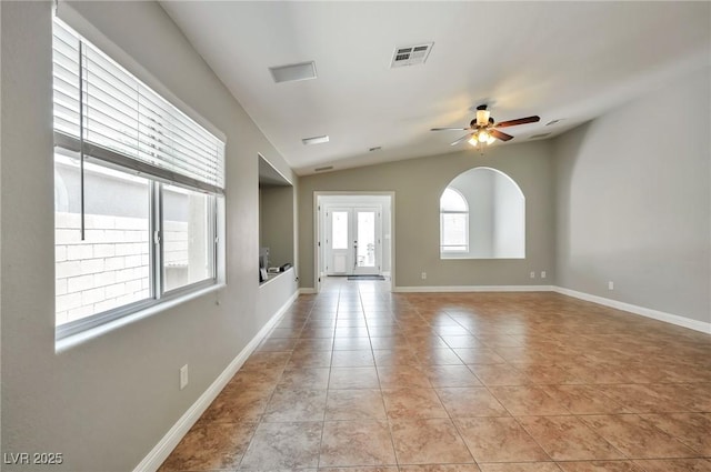 5732 Hornbrook St, North Las Vegas, NV 89031 - empty room with a ceiling fan, light tile patterned flooring, and lofted ceiling