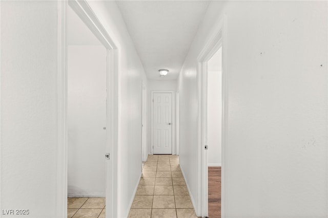 1901 Manhattan Dr, Las Vegas, NV 89106 - hallway featuring light tile patterned flooring and baseboards