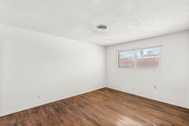 1901 Manhattan Dr, Las Vegas, NV 89106 - spare room with wood finished floors and a textured ceiling