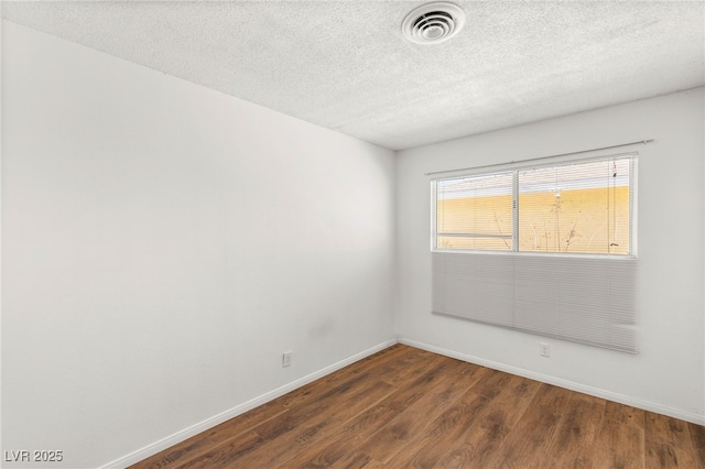 1901 Manhattan Dr, Las Vegas, NV 89106 - unfurnished room with wood finished floors and a textured ceiling