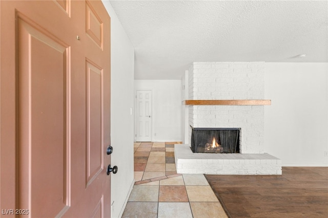 1901 Manhattan Dr, Las Vegas, NV 89106 - foyer entrance with a fireplace and a textured ceiling