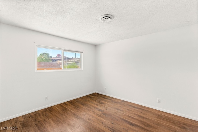 1901 Manhattan Dr, Las Vegas, NV 89106 - unfurnished room featuring wood finished floors and a textured ceiling