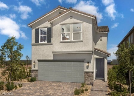 7388 Daly Grove St, Las Vegas, NV 89113 - view of front of house with driveway, an attached garage, stucco siding, and stone siding