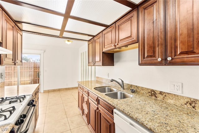 3668 Villa Knolls E Dr, Las Vegas, NV 89120 - kitchen featuring light stone countertops, light tile patterned floors, gas range oven, and white dishwasher