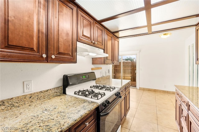 3668 Villa Knolls E Dr, Las Vegas, NV 89120 - kitchen featuring gas stove, under cabinet range hood, light stone countertops, and light tile patterned flooring