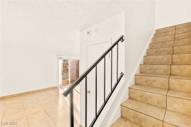 3668 Villa Knolls E Dr, Las Vegas, NV 89120 - stairs featuring a textured ceiling and tile patterned flooring