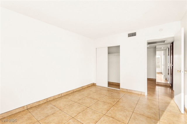 3668 Villa Knolls E Dr, Las Vegas, NV 89120 - unfurnished bedroom with light tile patterned floors and a closet