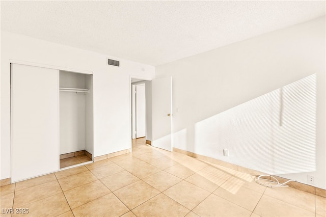 3668 Villa Knolls E Dr, Las Vegas, NV 89120 - unfurnished bedroom featuring a closet and light tile patterned flooring