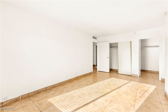 3668 Villa Knolls E Dr, Las Vegas, NV 89120 - unfurnished bedroom featuring light tile patterned floors and baseboards